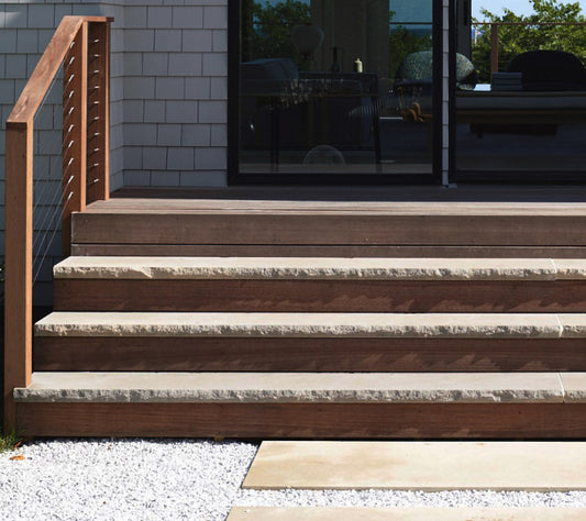 Representative limestone stair treads with rockfaced front edges; color and dimensions vary