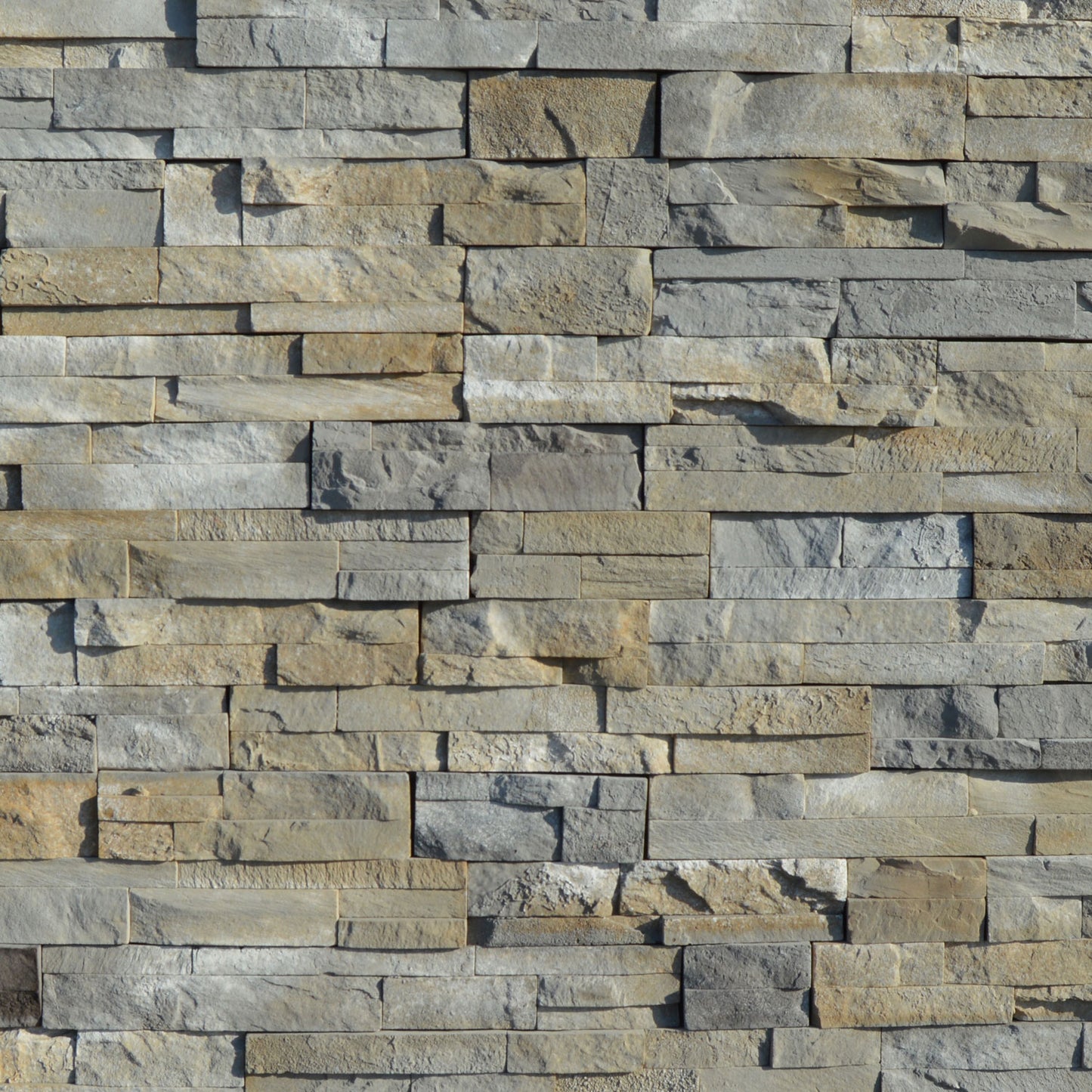 Pattern of stacked stone tiles in various shades of gray and brown.