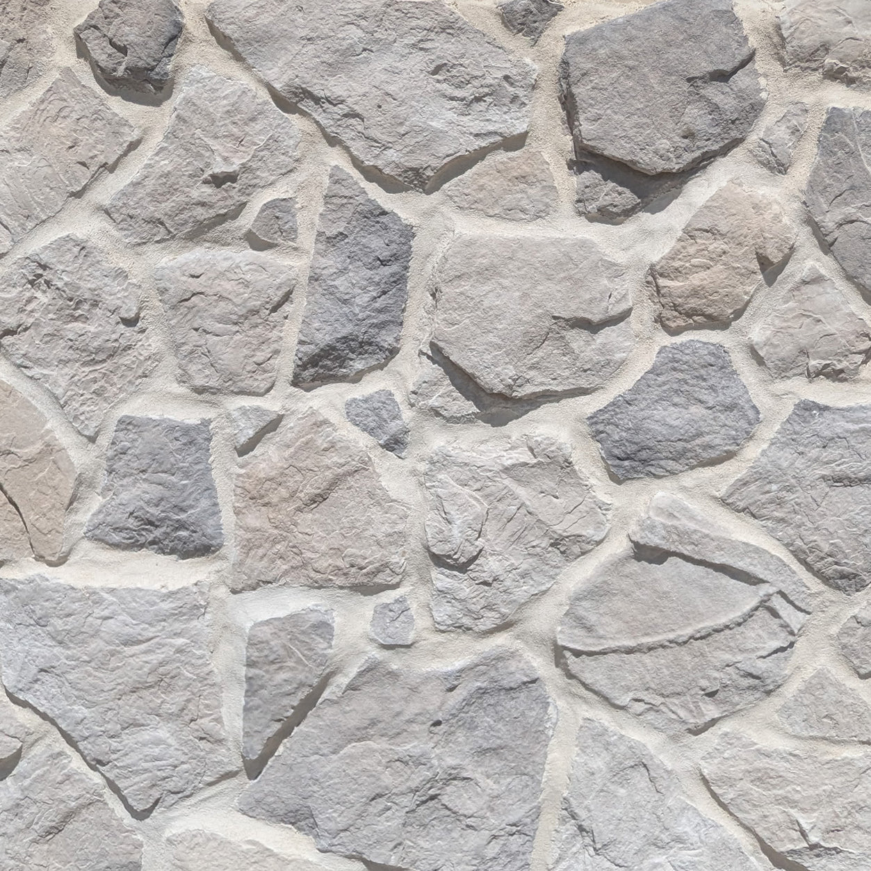 Prestige Acadia Fieldstone veneer featuring natural earth tones, irregular stone shapes, and rugged fieldstone texture.