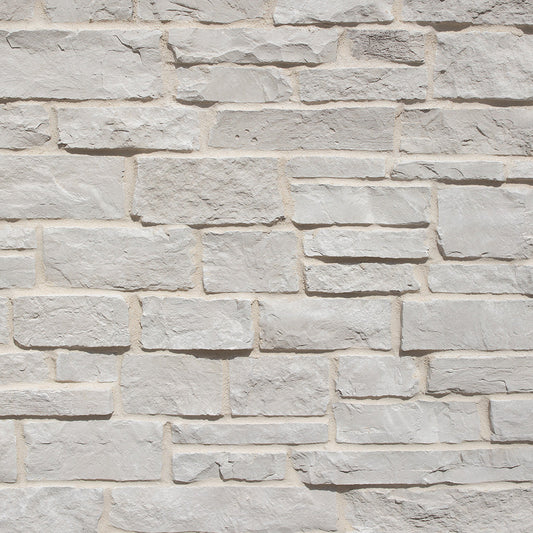 Prestige White Onyx Old County Ledge stone veneer with bright layered texture