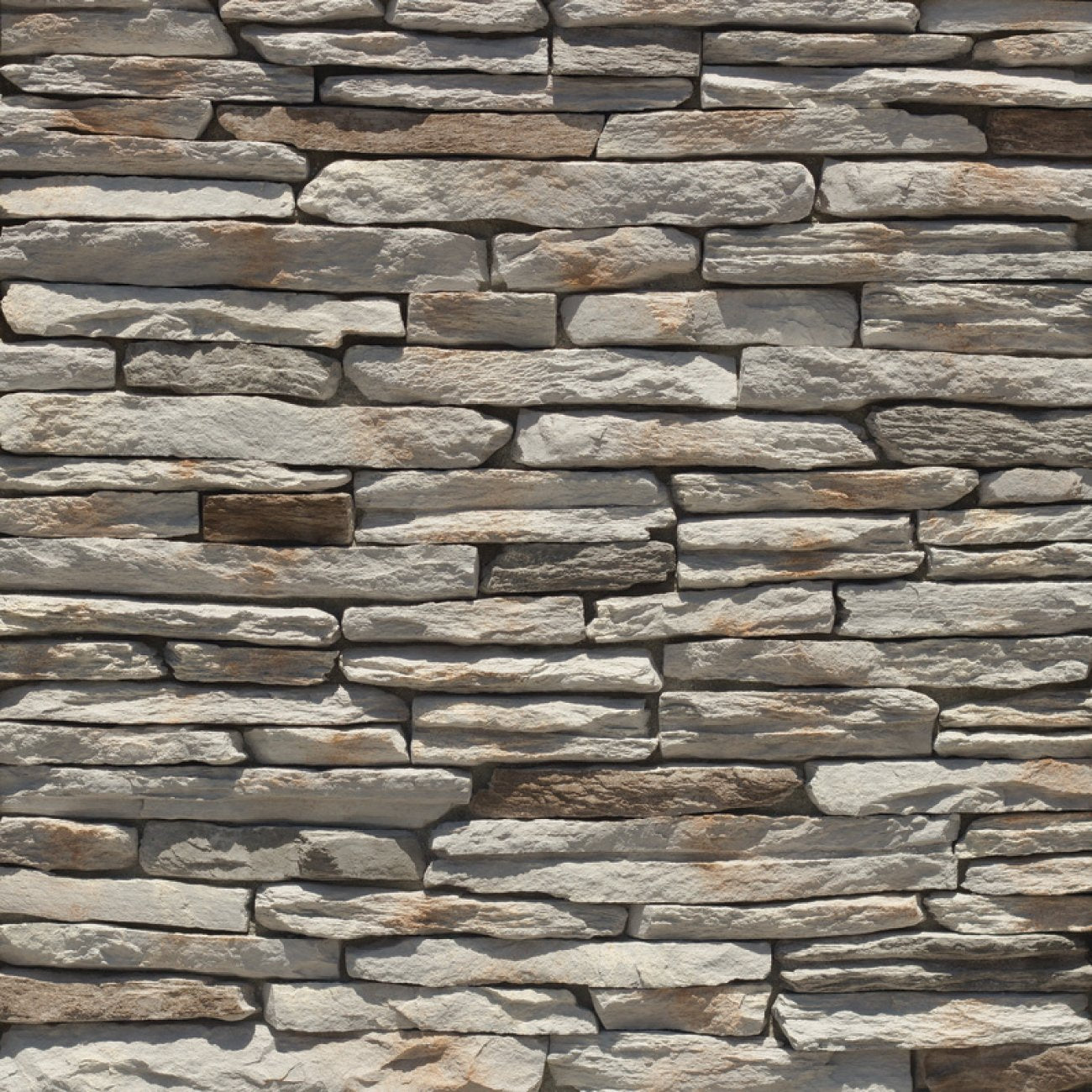 StoneCraft Hamilton Laurel Cavern Ledge stone veneer featuring gray and warm neutral tones, rugged ledgestone texture, and dimensional quarry-style stone character.