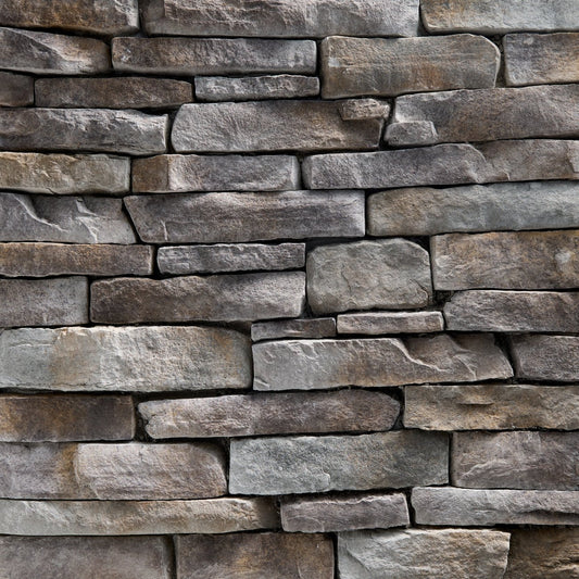 StoneCraft Mineral Ridge Ledgestone stone veneer featuring cool gray mineral tones, layered split-face texture, and dimensional stacked-stone character.