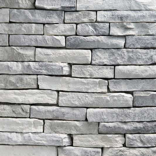 StoneCraft Silver Summit Ledgestone stone veneer featuring cool gray tones, layered split-face texture, and dimensional stacked-stone character.