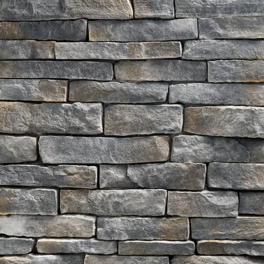 StoneCraft Steel Valley Ledgestone stone veneer featuring deep gray tones, layered split-face texture, and dimensional stacked-stone character